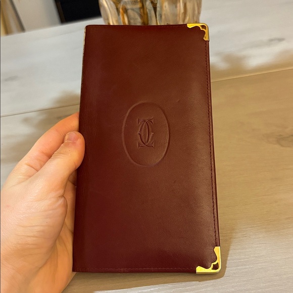 Cartier Handbags - Cartier‎ Burgundy Leather Wallet